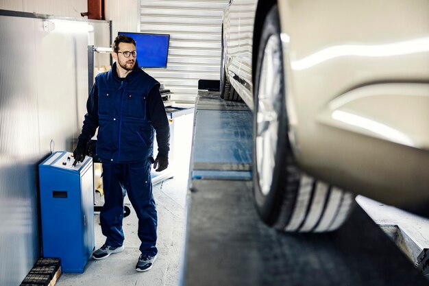 car mechanic garage lifting car look it